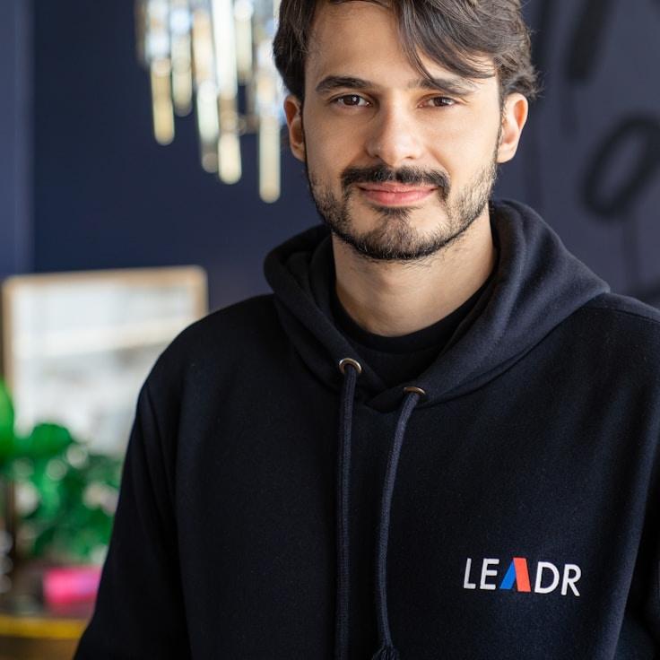 Liam Chen, Client Relations Director, discussing corporate gifting strategy with business clients