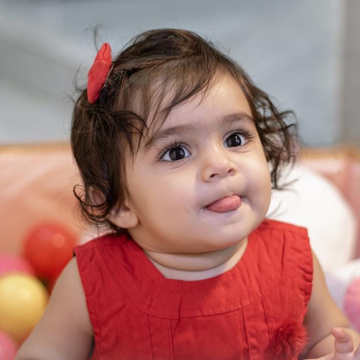 Asha Rao, Lead Design Curator at Atlas Grove Loom, reviewing corporate floral arrangements